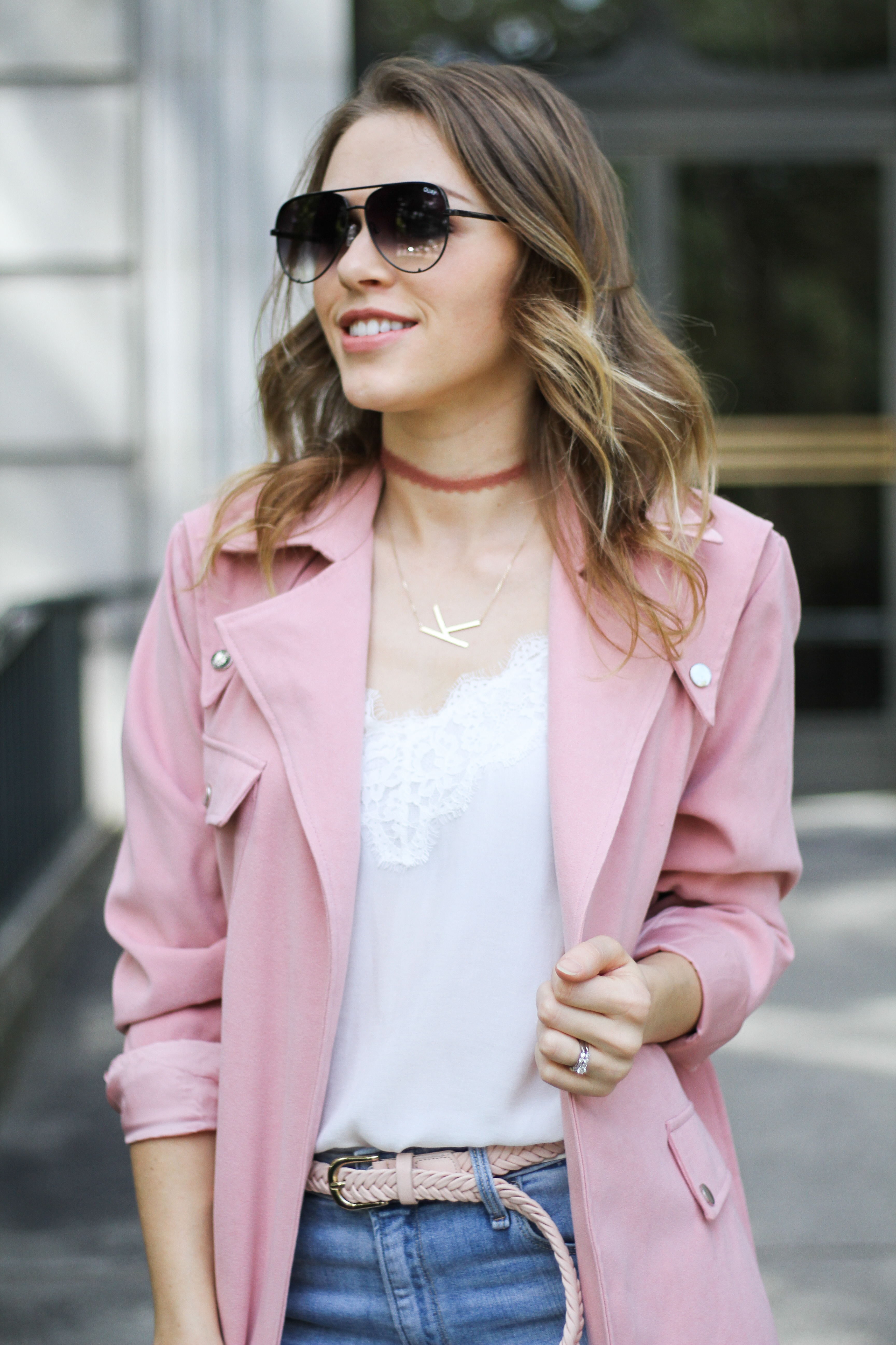 white lace trim cami with pink trenchcoat.