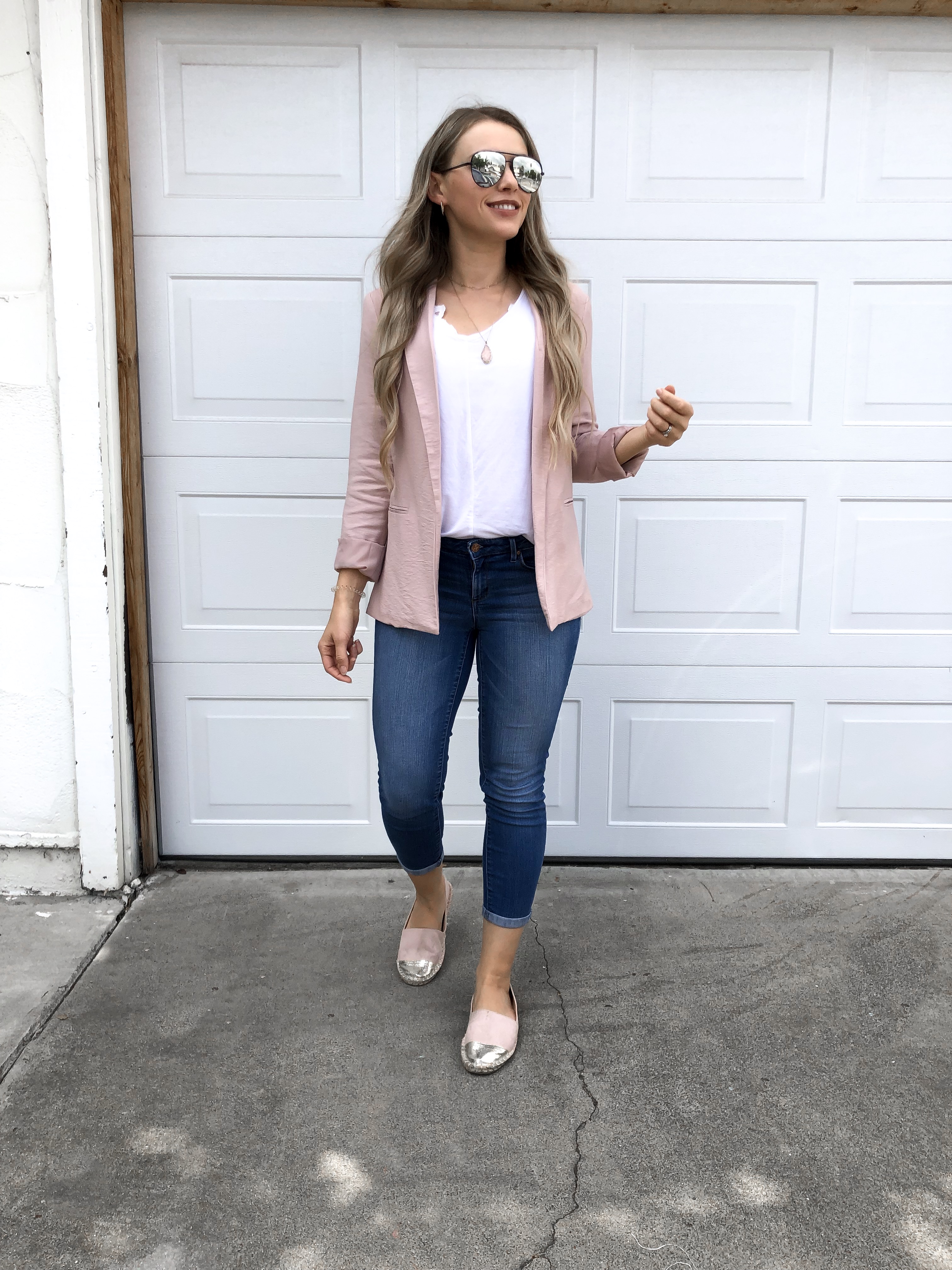womens outfit pink blazer over white tee shirt and ripped jeans