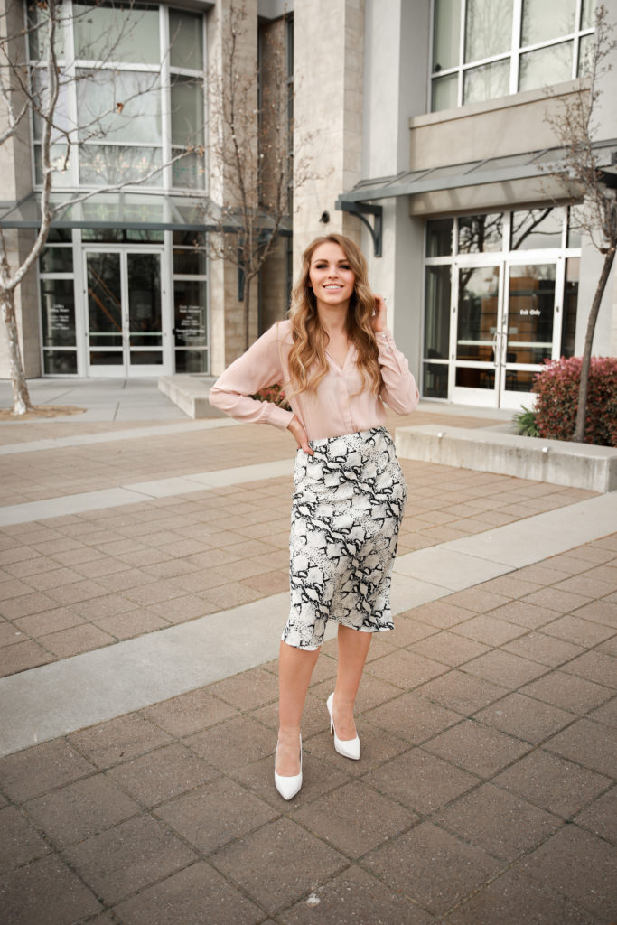 pink blouse snakeprint midi skirt white pumps outfit